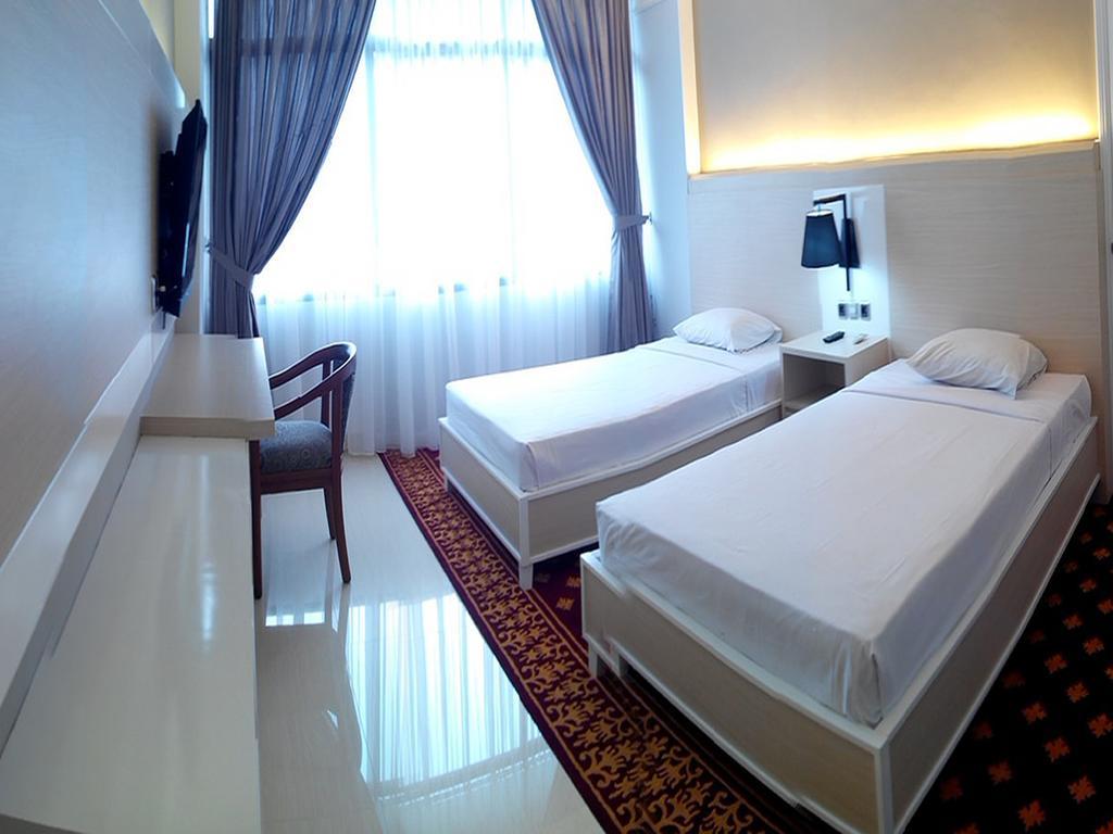Hotel Sandjaja Палембанг Номер фото